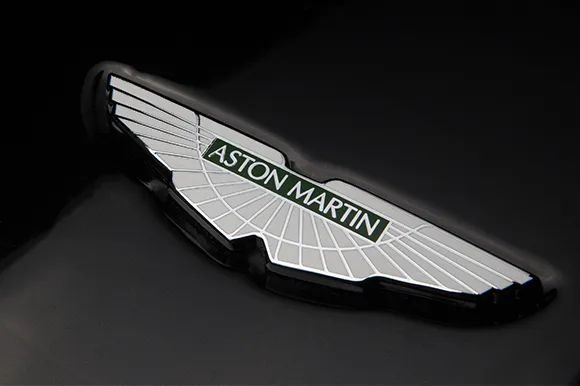 An Aston Martin badge on a black background.