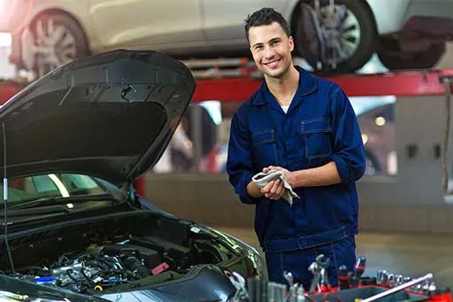 A car mechanic in an auto repair shop