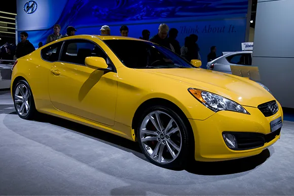 A yellow Hyundai Genesis on display at the North American International Auto Show.
