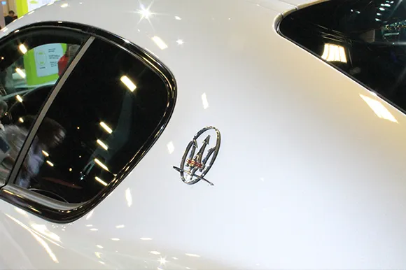 The rear side of a white Maserati vehicle.