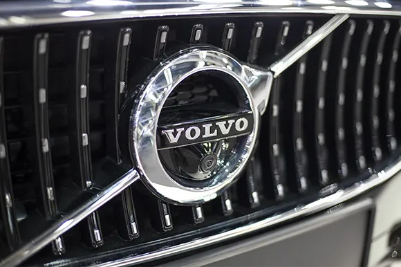 The grey logo of a Volvo vehicle.