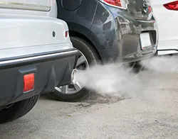 White smoke coming out of a car's exhaust pipes