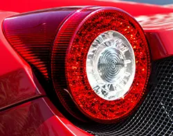 A bright red Ferrari's tail light