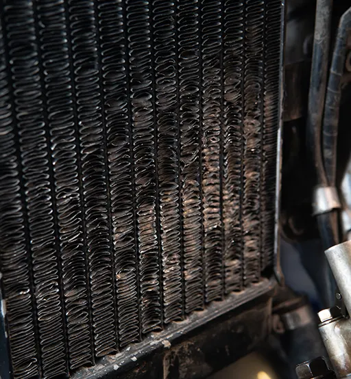 An old and worn-out motorcycle radiator