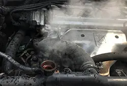 Overheating and smoking car engine due to failing thermostat